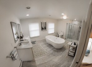 Shower, jetted tub, towels, soap