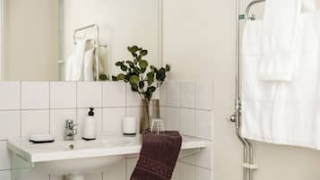 Shower, towels, soap, toilet paper