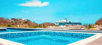 Stunning 2-bedroom condo with rooftop pool & walking distance beach in Huatulco.