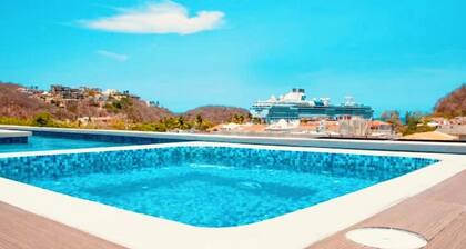 Stunning 2-bedroom condo with rooftop pool & walking distance beach in Huatulco.