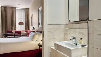Shower, designer toiletries, hair dryer, towels