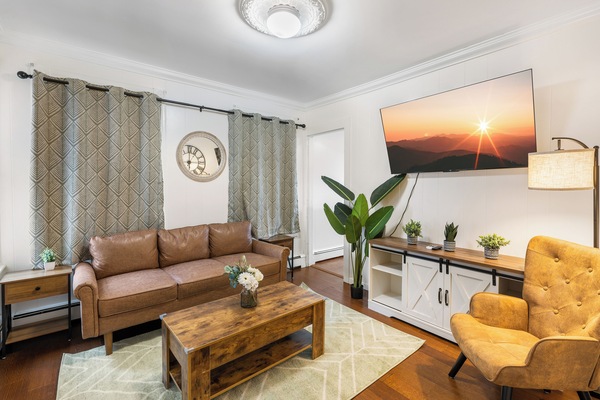 Cozy living room with natural light and stylish decor.