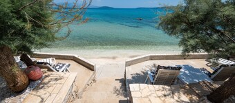 Beachfront villa Mihovil with direct beach access, garden, pool and mooring