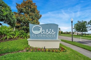 A sign for Oasis Clubhouse at ChampionsGate.