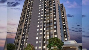 A high-rise residential building with multiple balconies, a flat roof, and a modern architectural design.