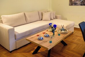 Signature Apartment, Balcony, City View | Living room | Flat-screen TV