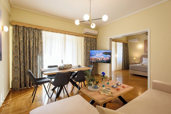 Signature Apartment, Balcony, City View | Living room | Flat-screen TV