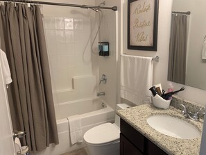 Hair dryer, towels, soap, shampoo
