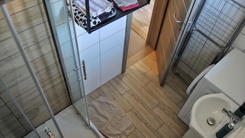 Shower, towels, soap, toilet paper