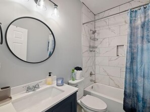 Shower, hair dryer, towels, toilet paper