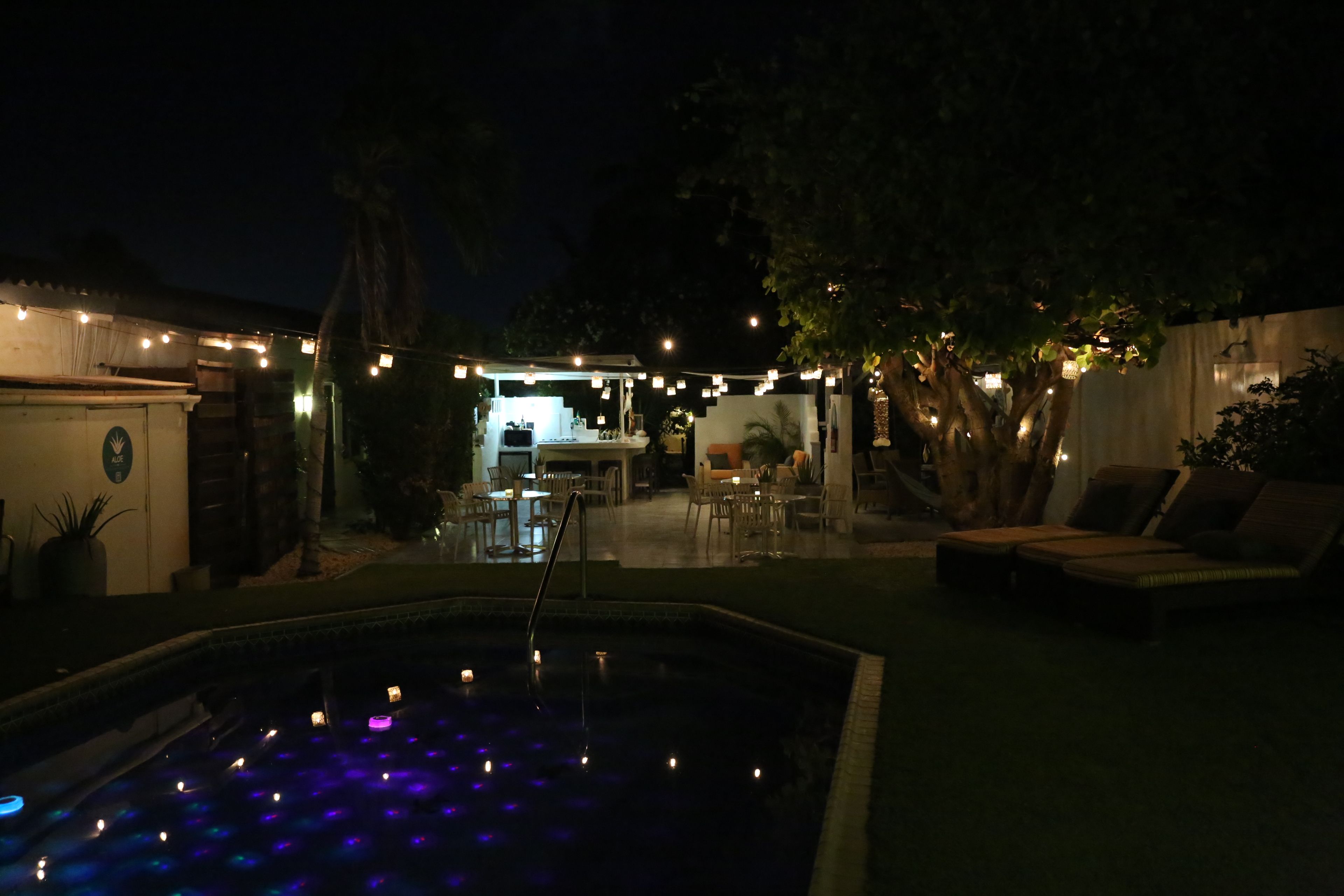 An outdoor pool area with a bar and seating.