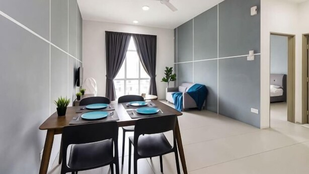 A modern dining area with a table set for four, a ceiling fan, and a view of a bedroom through a window. - DreamScape Apartment @ Golden Hill (Brinchang)
