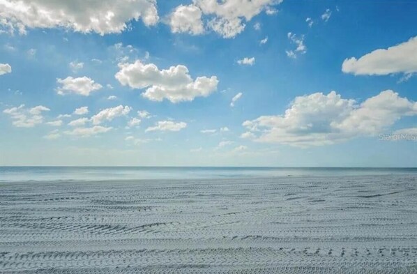 On the beach, sun loungers, beach towels