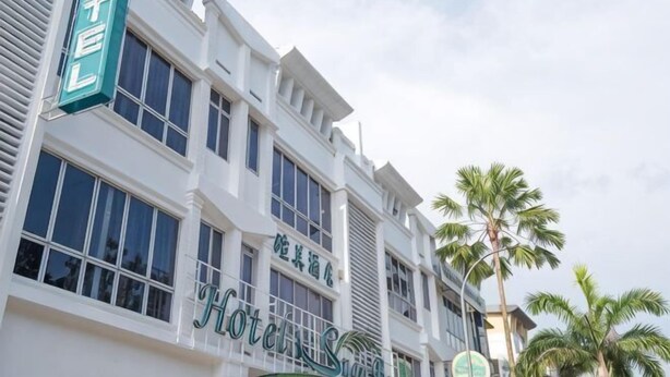 A multi-story hotel with a prominent sign reading 'HOTEL' and 'Hotel Star.' - Suan Bee Hotel@Sutera (Sekudai)