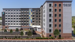 A multi-story hotel with a modern design, featuring a prominent vertical stripe pattern on the facade. - Homewood Suites By Hilton Columbia Downtown (Columbia)