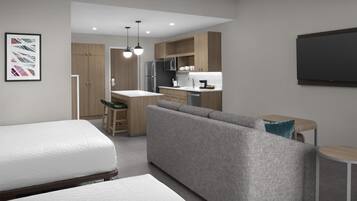 A modern, compact living space with a kitchenette, a sofa, a dining area, and a bed.