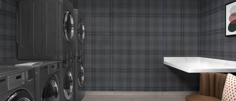 A laundry room with a washing machine, dryer, and a white shelf.