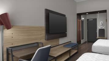 A modern hotel room with a wooden headboard, a flat-screen TV mounted on the wall, a desk with a chair, a bed with white bedding, and a small seating area.