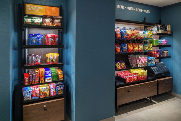 A snack vending machine with various snack options. - Hampton Inn By Hilton St Louis Airport (St. Louis)