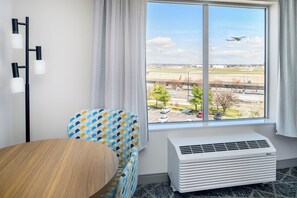 Premium bedding, desk, laptop workspace, blackout curtains