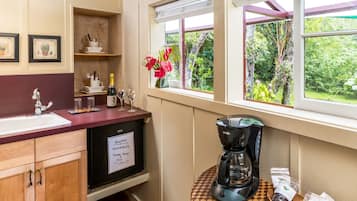 Fridge, microwave, coffee/tea maker, cookware/dishes/utensils