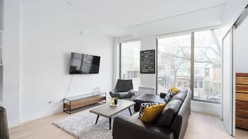 Appartement Exclusif | Coin séjour | Télévision à écran plat