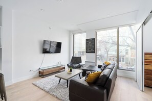 Appartement Exclusif | Coin séjour | Télévision à écran plat