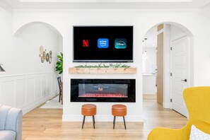 Smart TV, fireplace, books