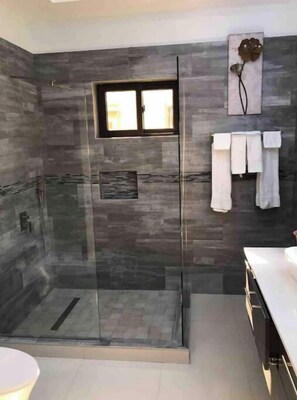 Shower, hair dryer, towels, soap