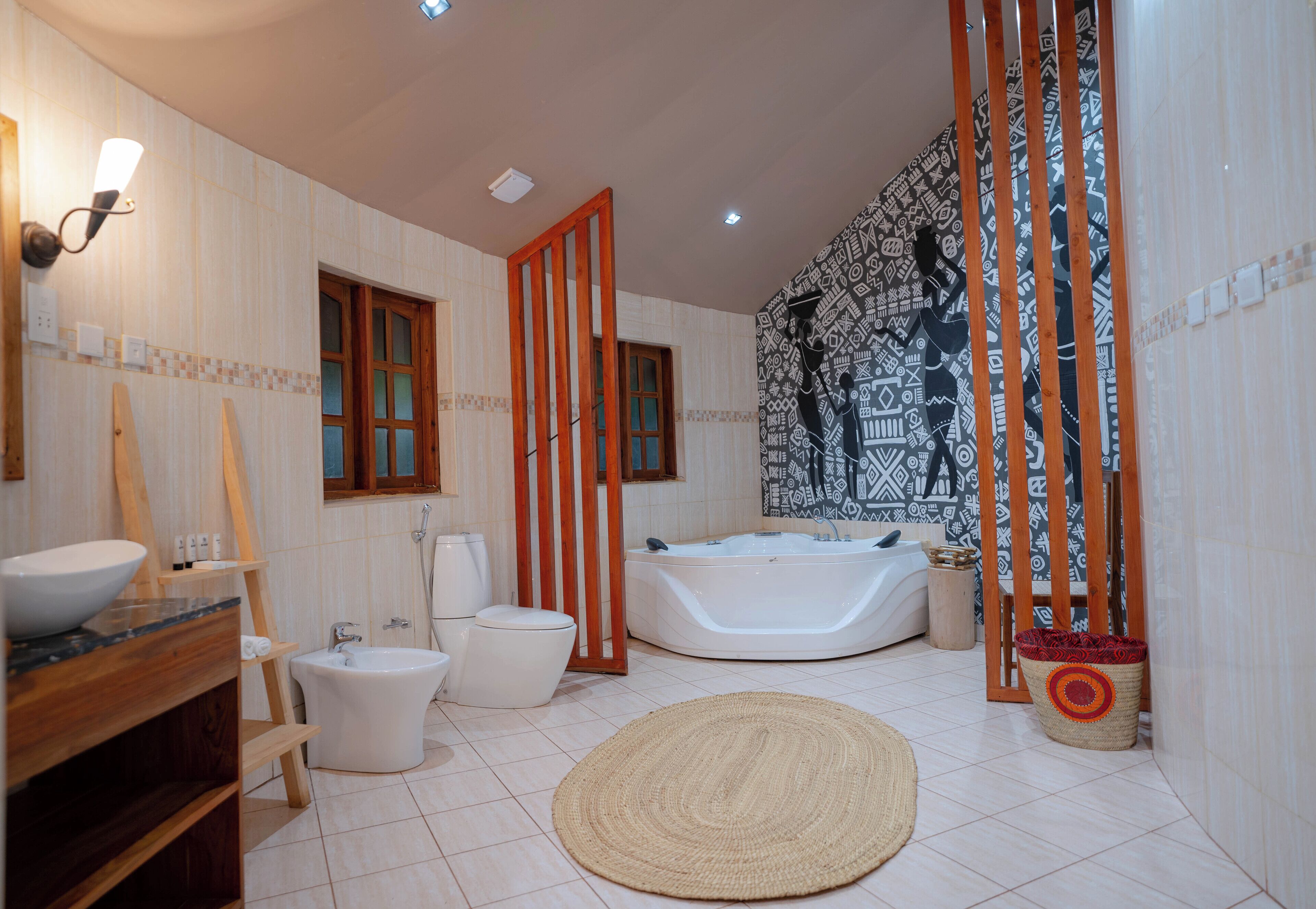 A bathroom with a bathtub, toilet, and sink.