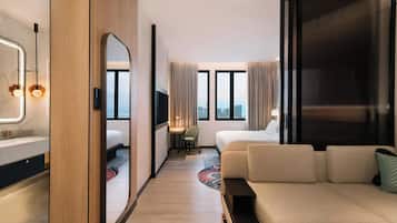 Junior Suite, 1 King Bed, City View | Living room | 55-inch Smart TV with satellite channels