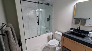 Shower, hair dryer, towels, soap