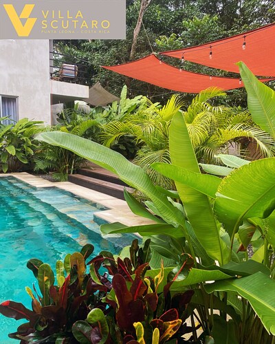 Charming 2-bedroom villa in wonderful Punta Leona with rooftop & patio. Pool