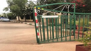 A gated entrance with a decorative metal gate, a paved driveway, and a vehicle parked nearby. -  5-beds apartment with AC, WiFi, Smart TV # Meknes (Meknes)