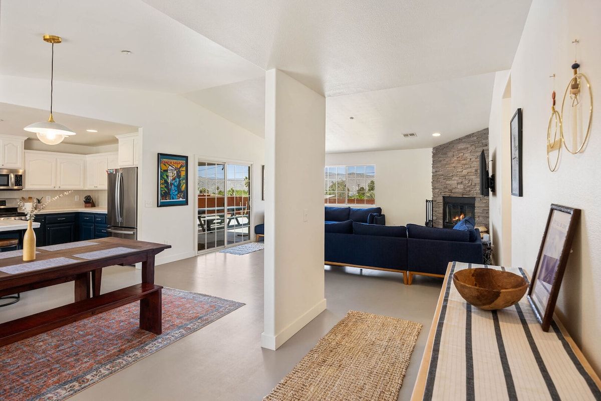 A modern interior with a kitchen, dining area, and living room.