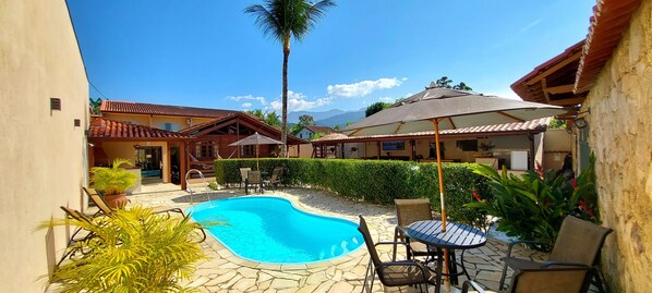 Outdoor pool, open 10:00 AM to 10:00 PM, pool umbrellas, sun loungers