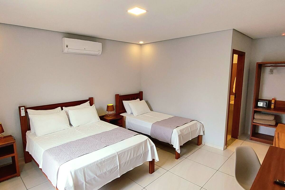 Triple Room | In-room safe, desk, laptop workspace, blackout drapes