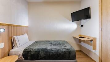 1 bedroom, desk, iron/ironing board, travel crib