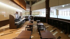 A modern hotel lobby with a central counter, multiple seating areas, and a high ceiling with exposed beams. - Hotel Alpha-One Tsuruga-Bypass (Tsuruga)