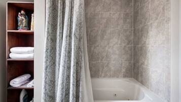 Shower, hair dryer, towels, shampoo