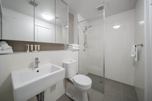 Shower, hair dryer, towels, shampoo