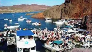 A marina with boats docked and people gathered on the shore. - Luxury Retreat Pool House with spectacular views!

 (Lake Havasu City)