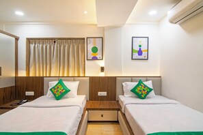 Standard Room | Individually furnished, desk, blackout drapes, iron/ironing board - Treebo Petals Suites & Banquet - New Town (Barasat)