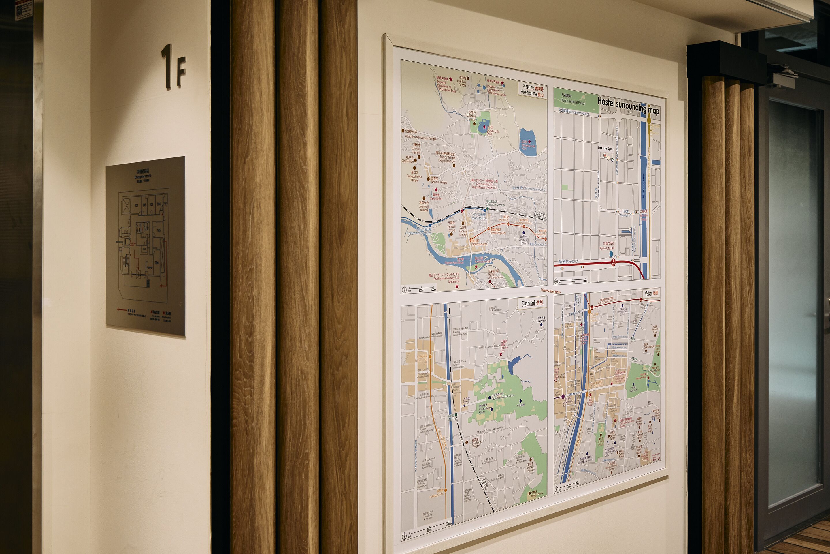 A wall with a map and a room layout diagram.