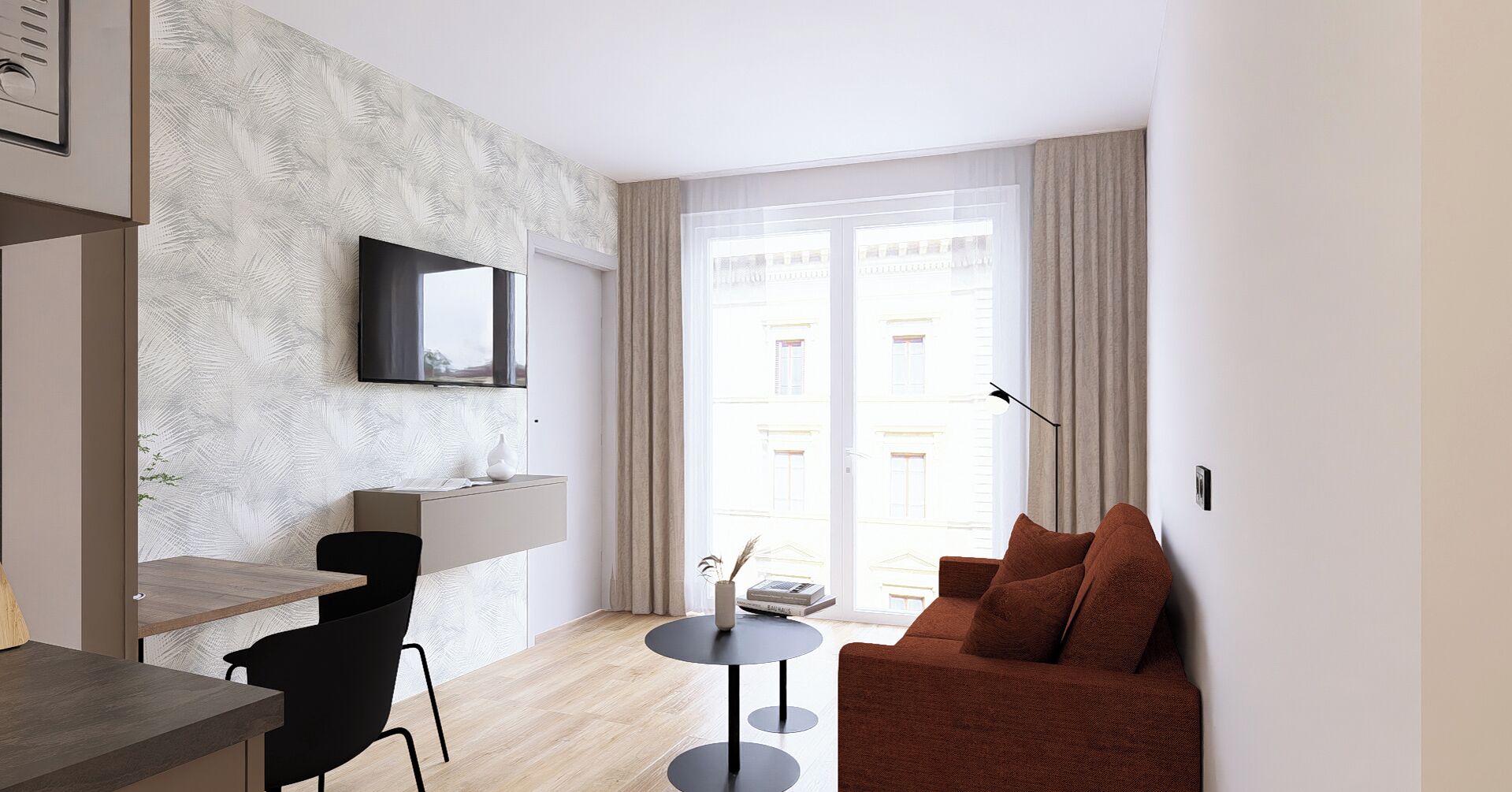 A modern living room with a flat-screen TV mounted on the wall, a brown sofa, a small round table, and a dining area with a wooden table and black chairs.
