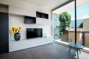 Economy Apartment, Balcony | Living area | 32-inch flat-screen TV with satellite channels - Flat Iron Apartments  (Lugano)