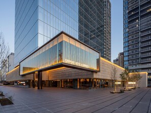 A modern hotel with a glass facade, a prominent entrance, and a well-lit outdoor area. - SAPPORO HOTEL by GRANBELL (Sapporo)