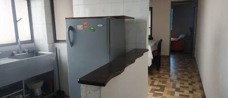 Fridge, coffee grinder, cookware/dishes/utensils, lobster pot