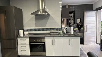 Highchair, cookware/dishes/utensils, spices, lobster pot