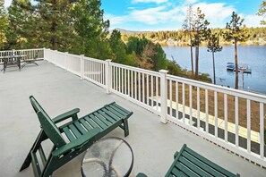 Terrace/patio - Lakefront Splendor:Spectacular Lakefront Property w/Private Dock! Pool Table + Foosball Table! Spacious Outdoor Deck! Patio & Yard w/Firepit! (Big Bear Lake)